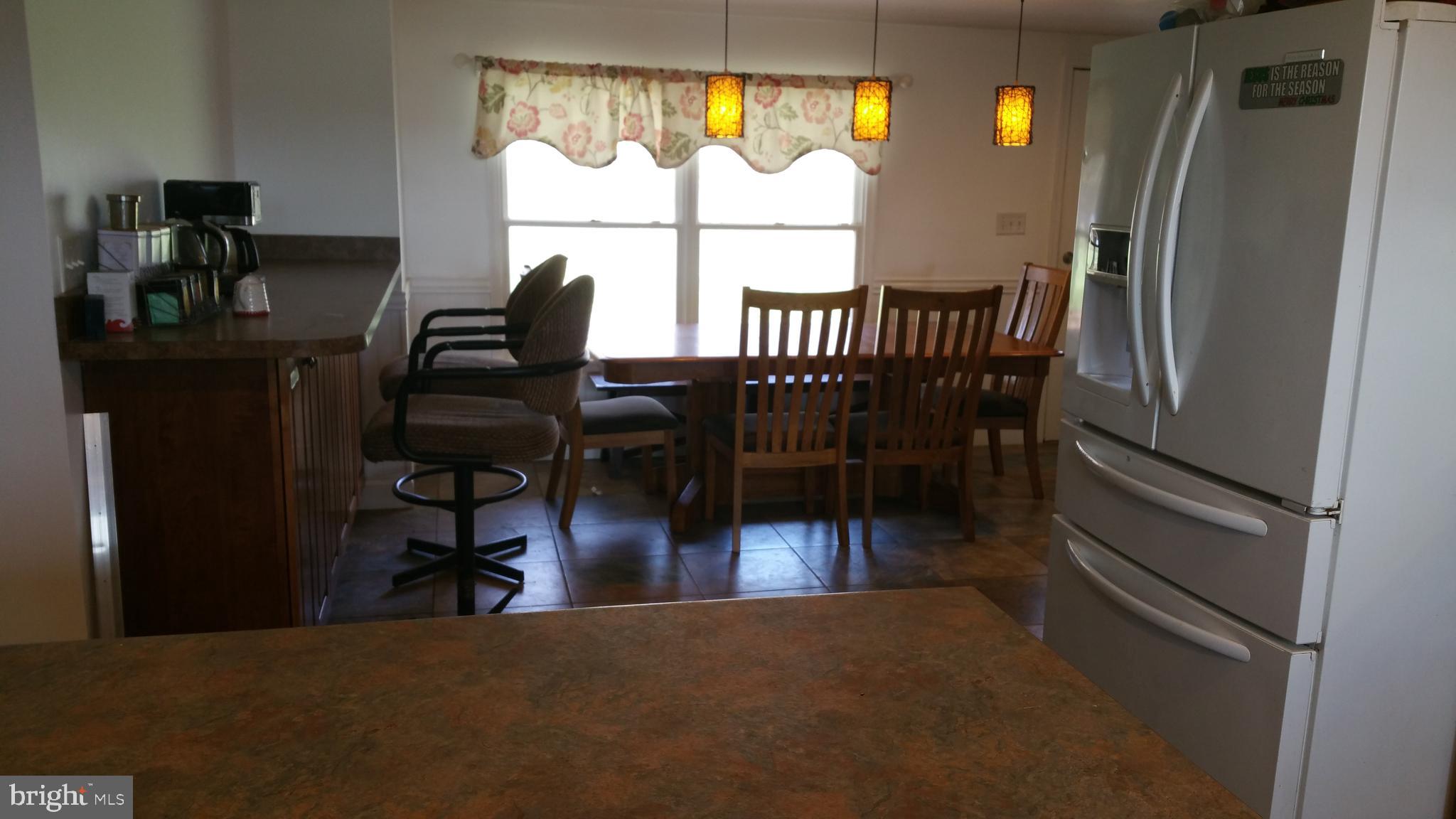Kitchen looking over island into dining room