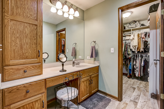 2767 Sun Valley Road Lisle, IL 60532 - Photo 12 of 23 a bathroom with a sink a mirror and a shower