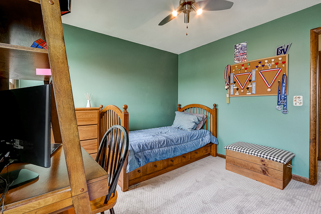 2767 Sun Valley Road Lisle, IL 60532 - Photo 14 of 23 a bedroom with a bed and a flat screen tv