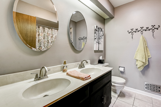 2767 Sun Valley Road Lisle, IL 60532 - Photo 15 of 23 a bathroom with a toilet sink and mirror