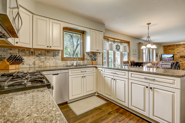2767 Sun Valley Road Lisle, IL 60532 - Photo 3 of 23 a kitchen with stainless steel appliances granite countertop a stove a sink and a granite counter tops