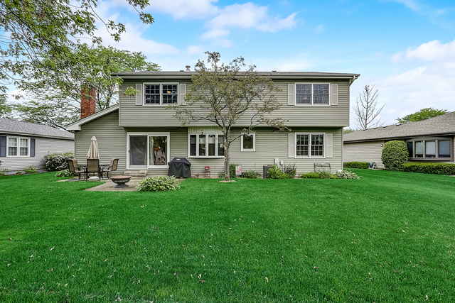 2767 Sun Valley Road Lisle, IL 60532 - Photo 21 of 23 a front view of a house with a garden and porch