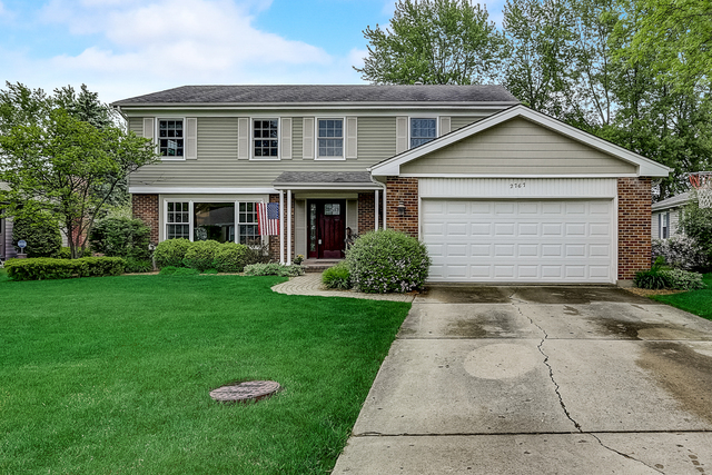 2767 Sun Valley Road Lisle, IL 60532 - Photo 22 of 23 a front view of house with yard and green space