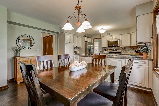 2767 Sun Valley Road Lisle, IL 60532 - Photo 6 of 23 a view of a dining room with furniture and wooden floor