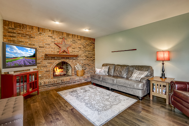 2767 Sun Valley Road Lisle, IL 60532 - Photo 8 of 23 a living room with furniture and a fireplace
