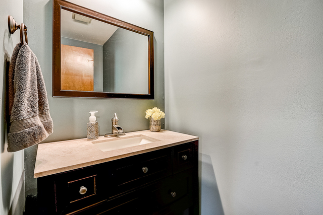 2767 Sun Valley Road Lisle, IL 60532 - Photo 9 of 23 a bathroom with a sink and a mirror