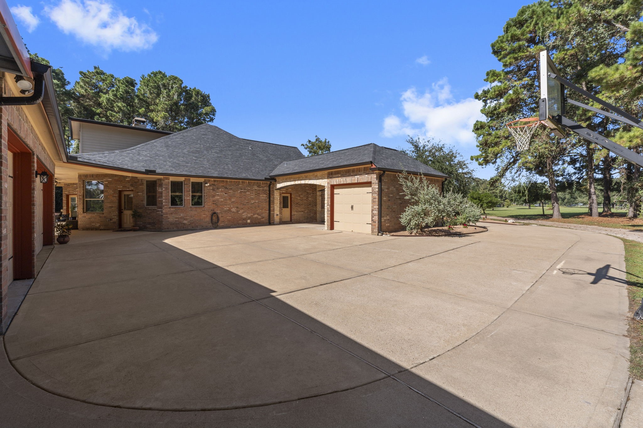 1534 Virgie Community Road Magnolia, TX 77354 - Photo 7 of 50 Single garage shown which is large enough for a car but perfect for golf carts and toys as well. Notice the Porte-Cochere between the home and garage.
