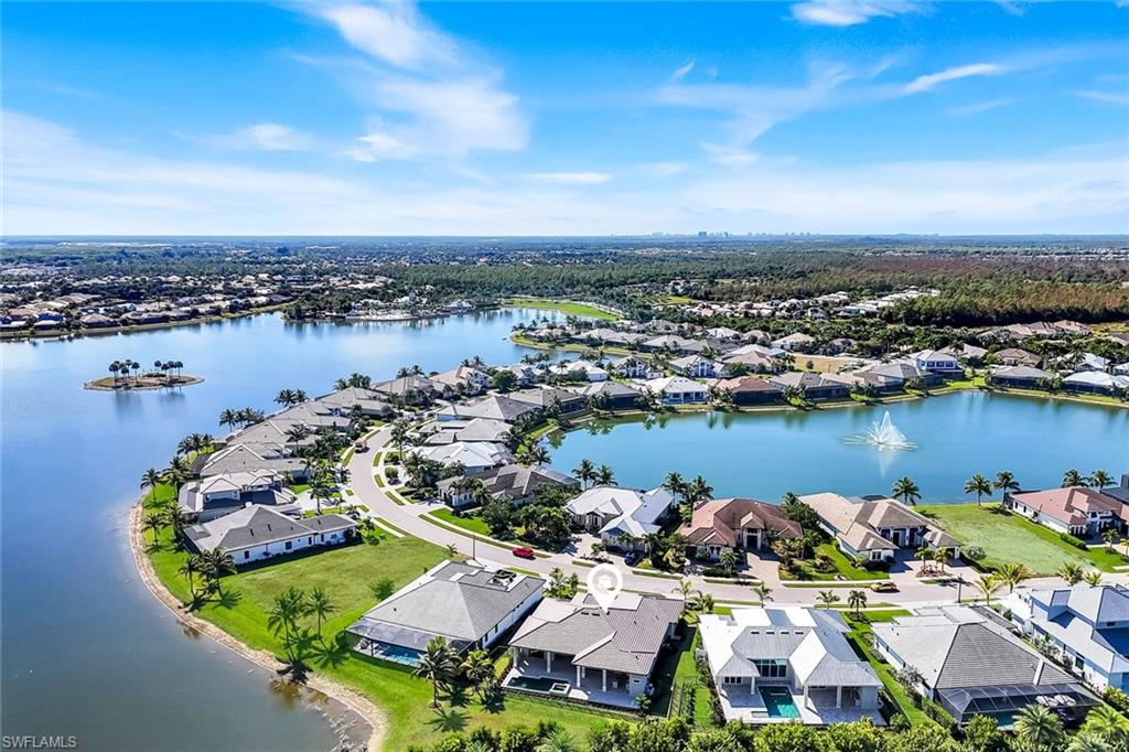 14282 Charthouse Circle Naples, FL 34114 - Photo 7 of 48 Aerial perspective of suburban area featuring a large body of water