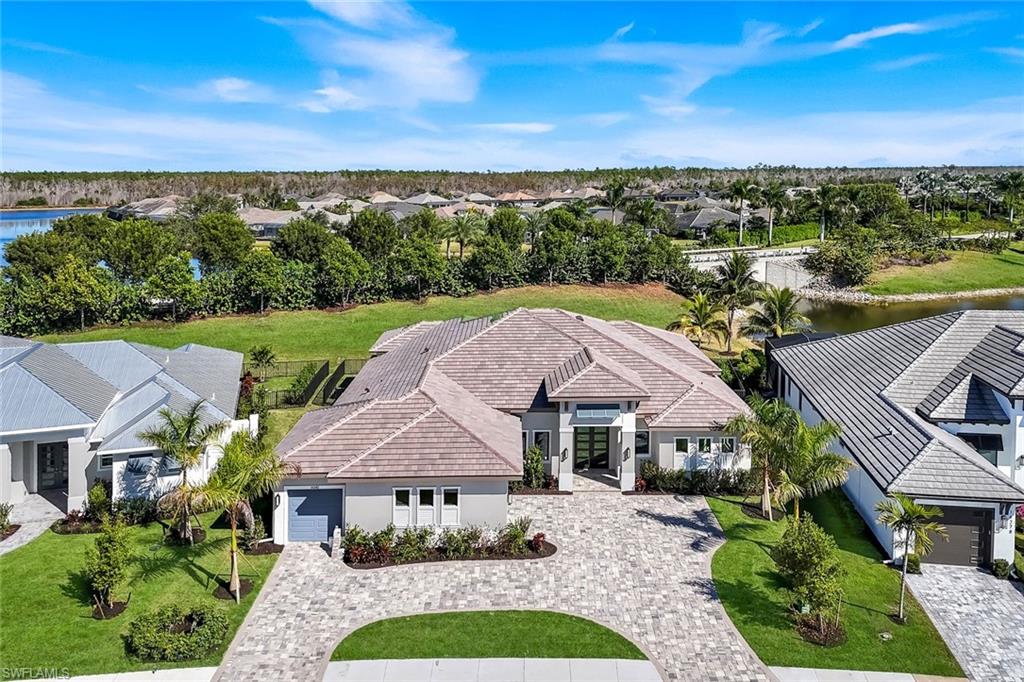 14282 Charthouse Circle Naples, FL 34114 - Photo 8 of 48 Aerial view of residential area featuring a nearby body of water