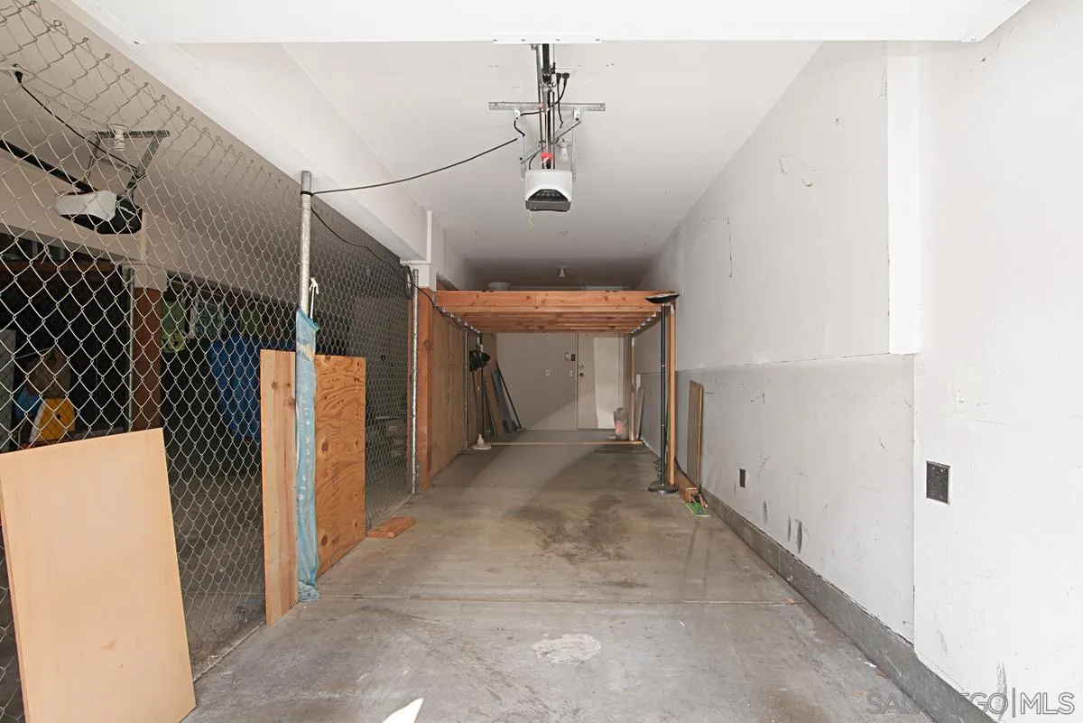 11235 Affinity Court, Unit 68 San Diego, CA 92131 - Photo 26 of 29 a view of a hallway with a white house