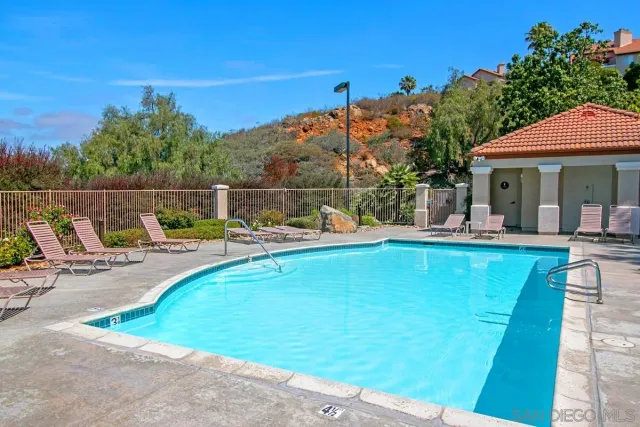 a view of swimming pool with outdoor seating yard and mountain view