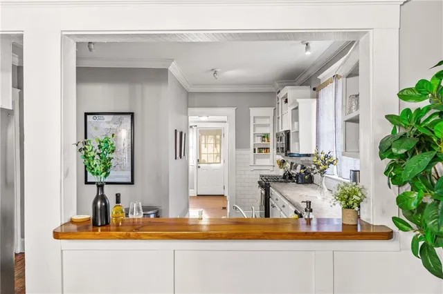 a view of a living room and entryway