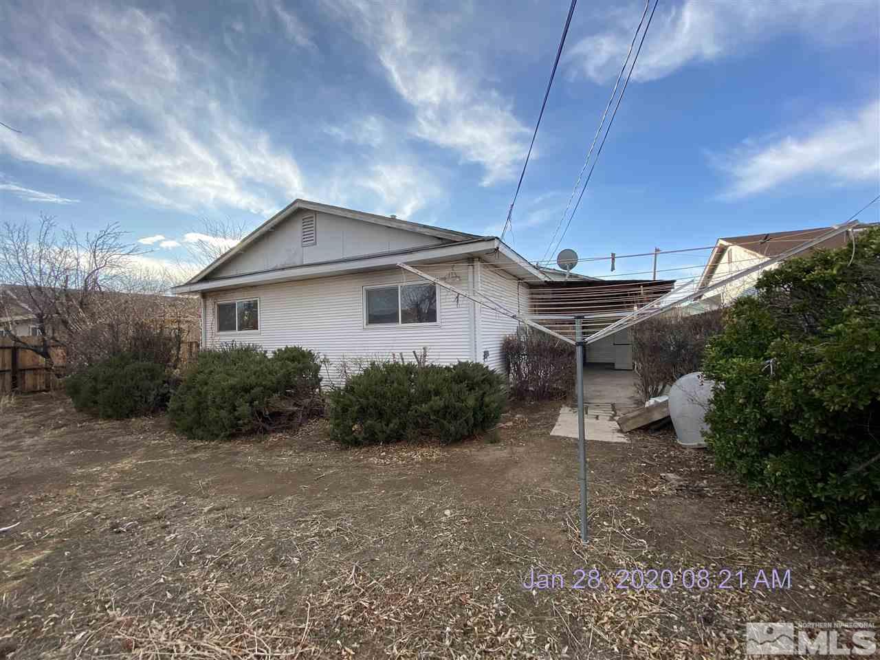1715 Haddock Drive Reno, NV 89512 - Photo 14 of 17 a view of a house with a yard and plants