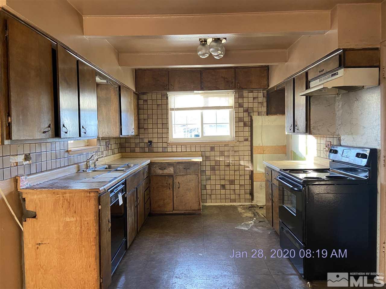 1715 Haddock Drive Reno, NV 89512 - Photo 4 of 17 a kitchen with a stove sink and cabinets