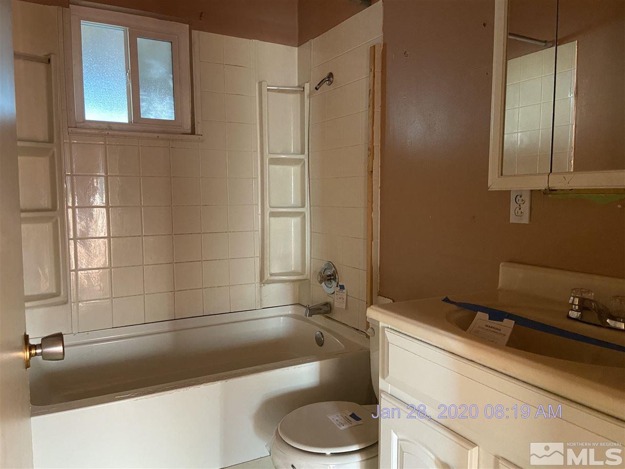 1715 Haddock Drive Reno, NV 89512 - Photo 7 of 17 a bathroom with a sink a toilet and bathtub