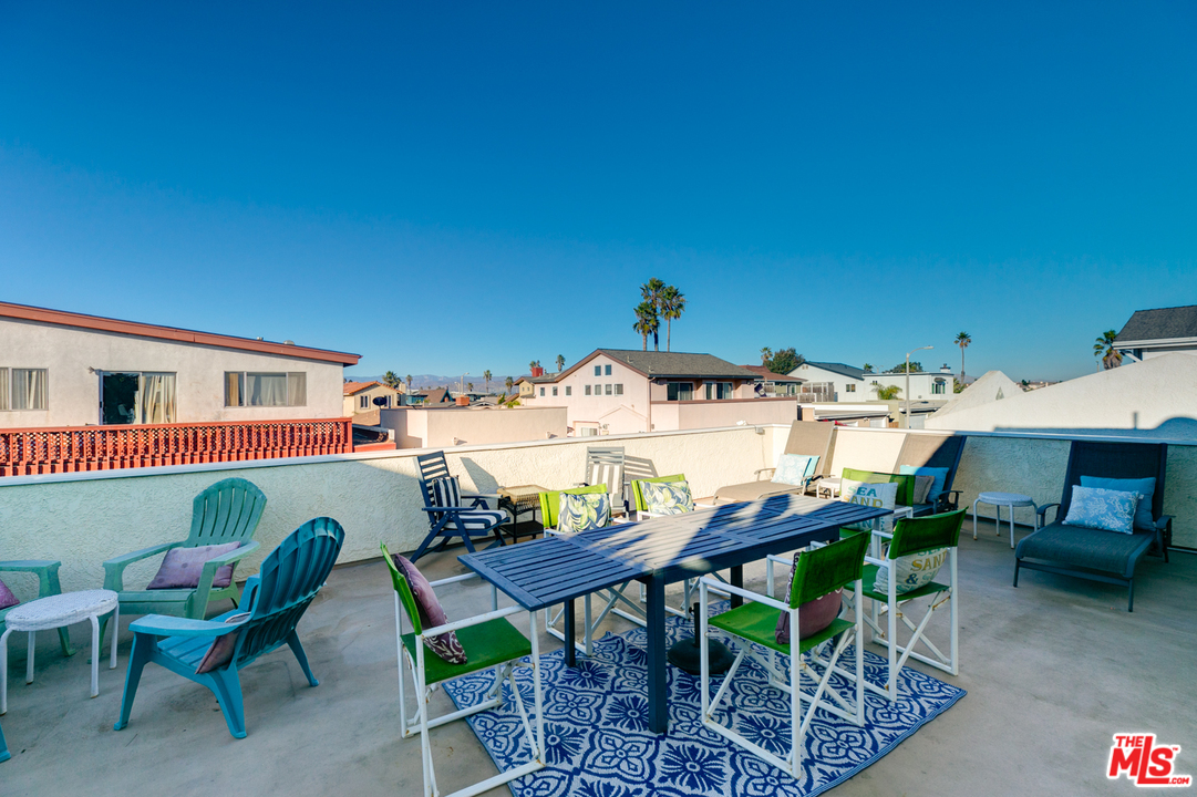 4850 Amalfi Way Oxnard, CA 93035 - Photo 19 of 28 a view of a patio with table and chairs