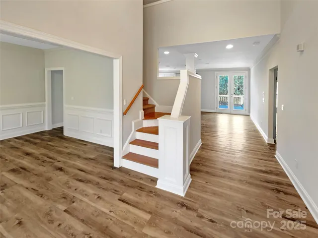a view of entryway with wooden floor