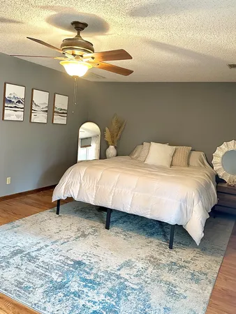 a bedroom with a bed and window