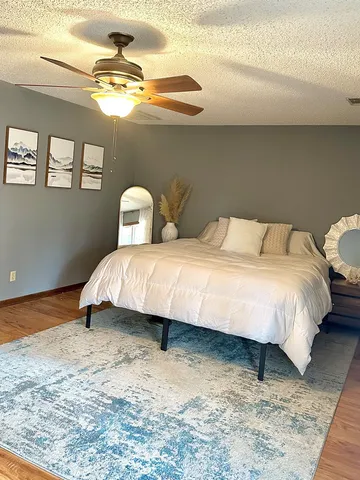 a bedroom with a bed and window