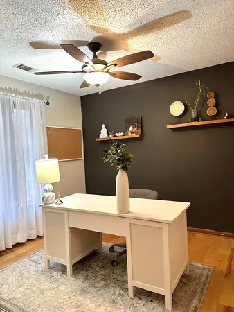 a dining room with table and couch