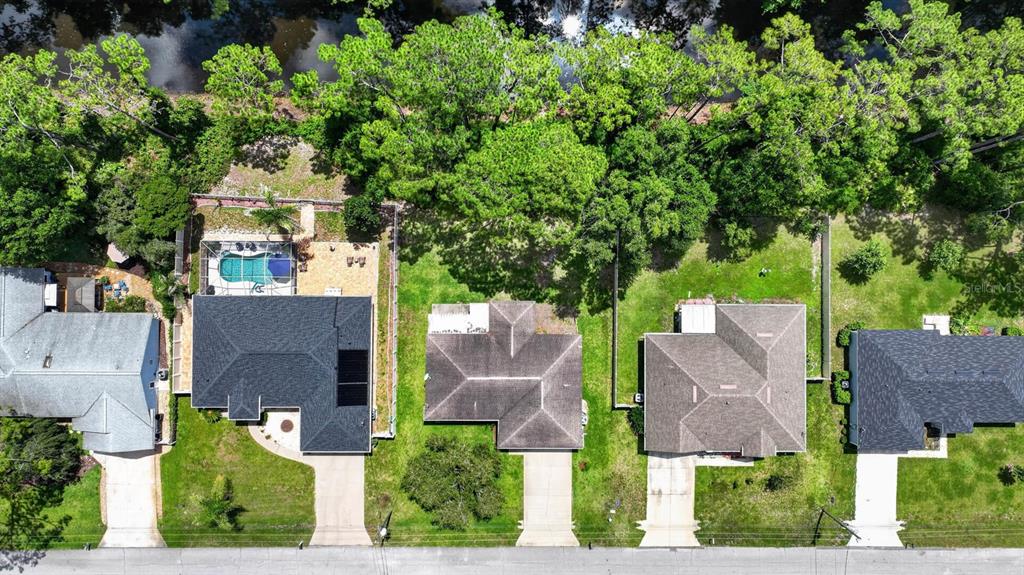 80 Roxboro Drive Palm Coast, FL 32164 - Photo 39 of 39 an aerial view of multiple houses with yard
