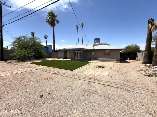 a view of a backyard of the house