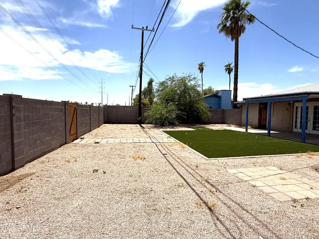 a view of a backyard with potted plants