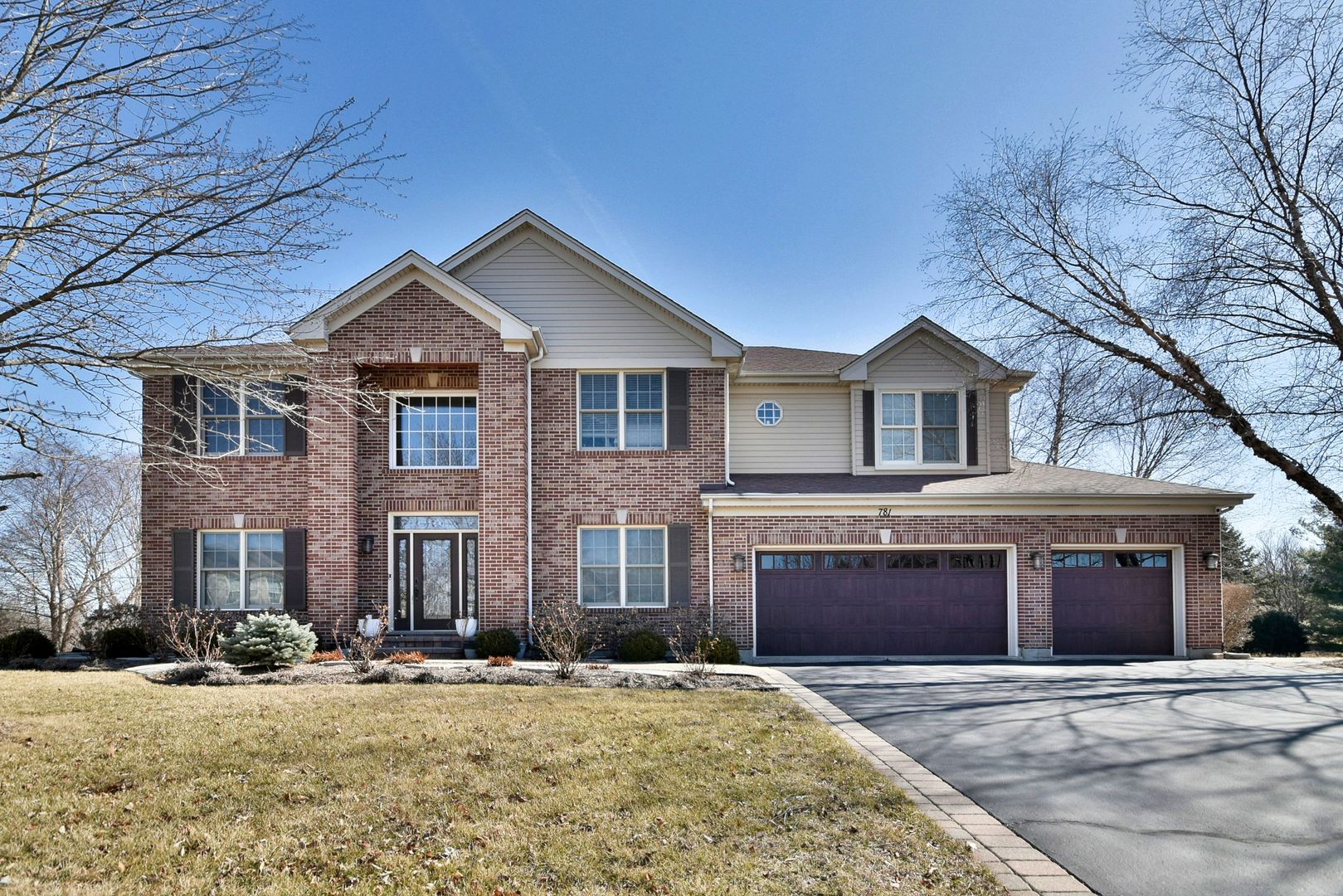 a front view of a house with yard