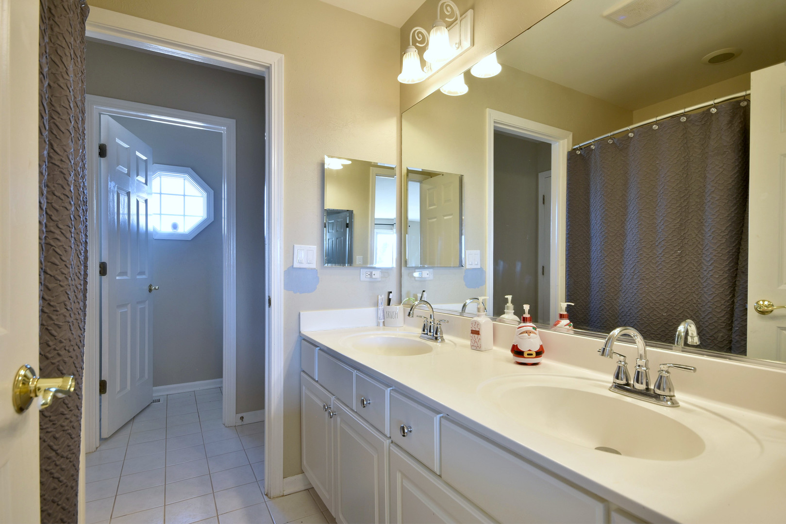 781 Hayrack Drive Algonquin, IL 60102 - Photo 27 of 54 a bathroom with double vanity sinks a vanity a mirror and a shower