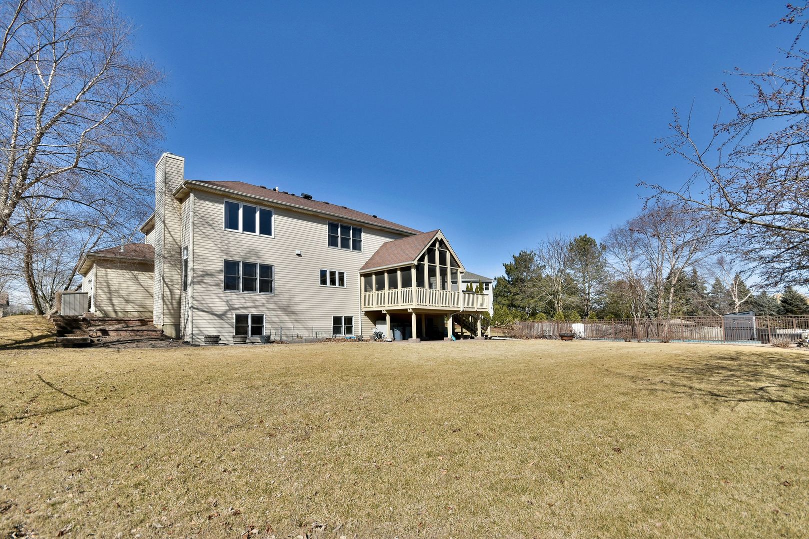 781 Hayrack Drive Algonquin, IL 60102 - Photo 41 of 54 a view of house with yard and trees in the background