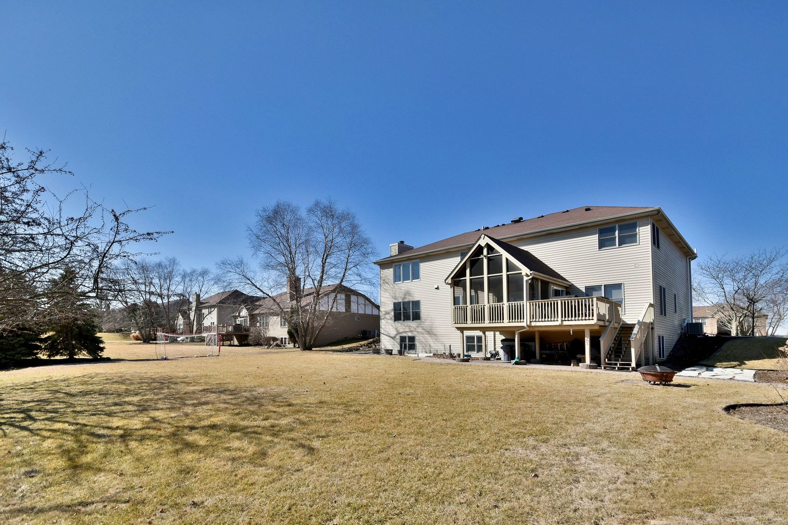 781 Hayrack Drive Algonquin, IL 60102 - Photo 43 of 54 a front view of a house with a yard covered in snow