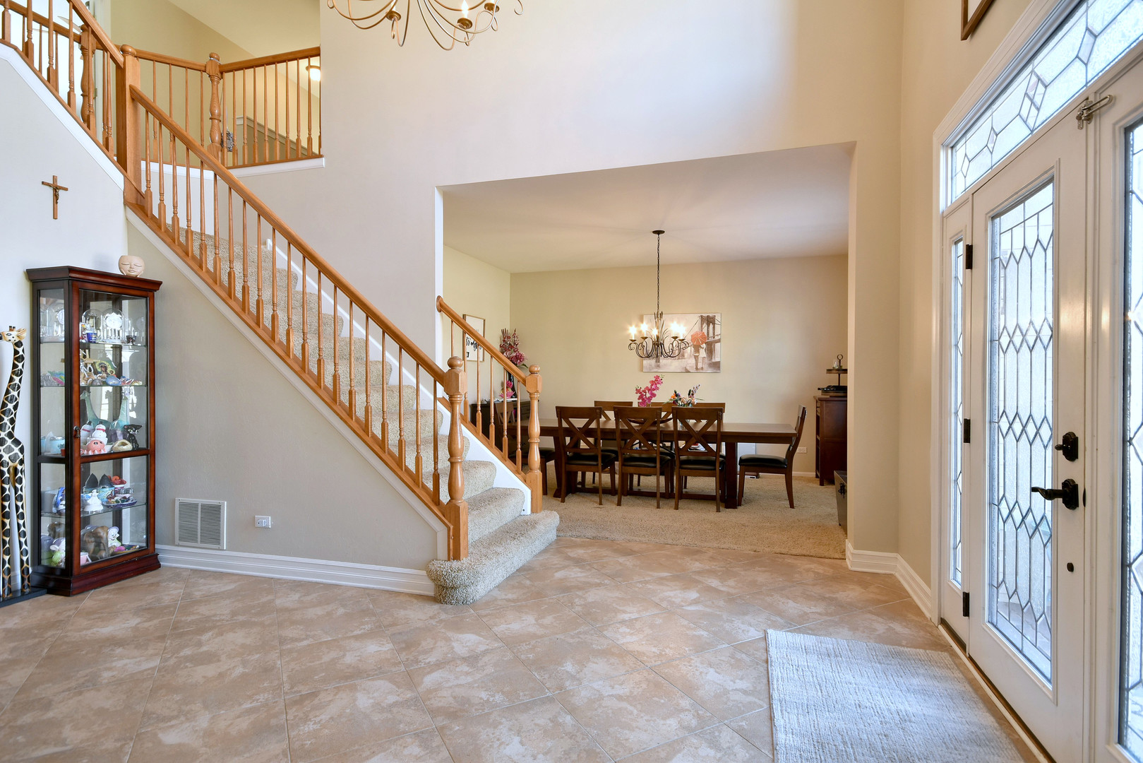 781 Hayrack Drive Algonquin, IL 60102 - Photo 5 of 54 a view of a hallway with dining room and furniture