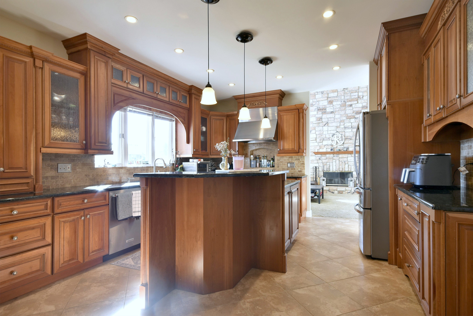 781 Hayrack Drive Algonquin, IL 60102 - Photo 9 of 54 a kitchen with stainless steel appliances granite countertop a refrigerator a sink dishwasher a oven and a dining table with wooden floor