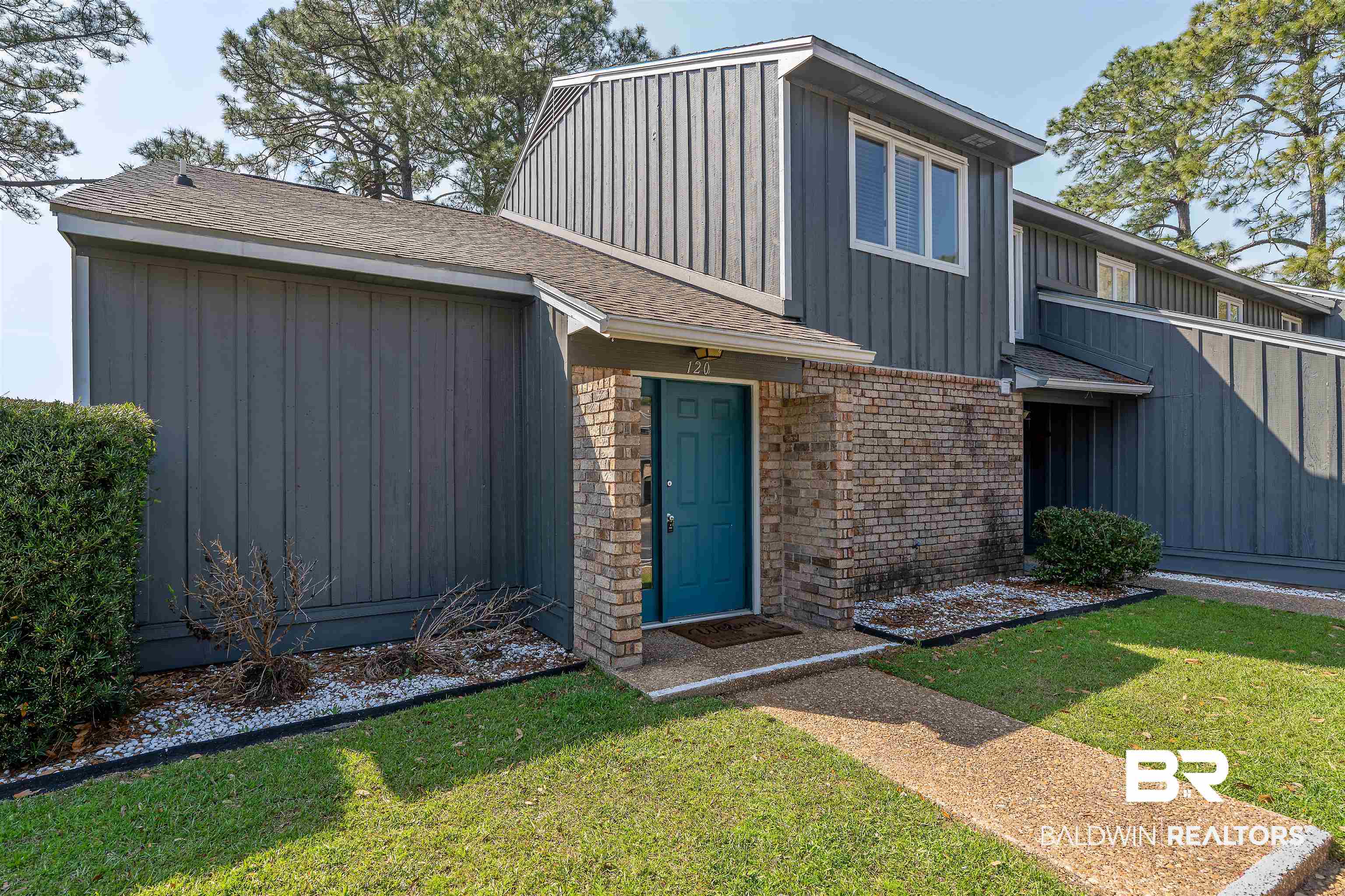 1701 Regency Road, Unit 120 Gulf Shores, AL 36542 - Photo 1 of 33 Community pool with a fenced backyard and a patio area