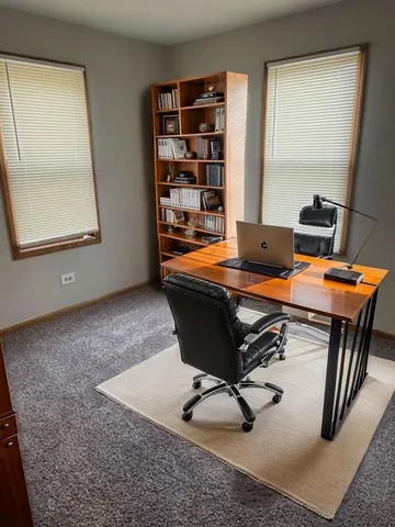 a view of a workspace with furniture