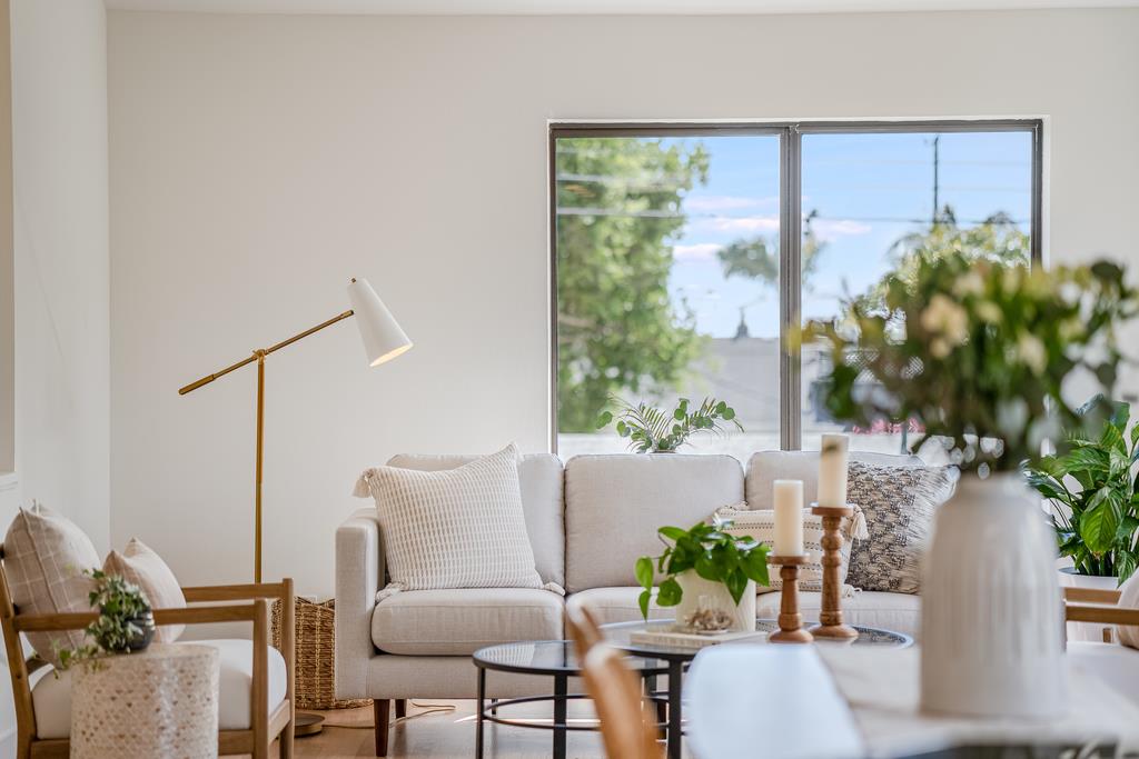 117 El Camino Del Mar Aptos, CA 95003 - Photo 11 of 60 a living room with furniture and a potted plant