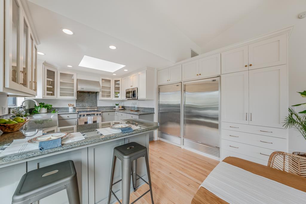 117 El Camino Del Mar Aptos, CA 95003 - Photo 13 of 60 a kitchen with counter top space cabinets and appliances