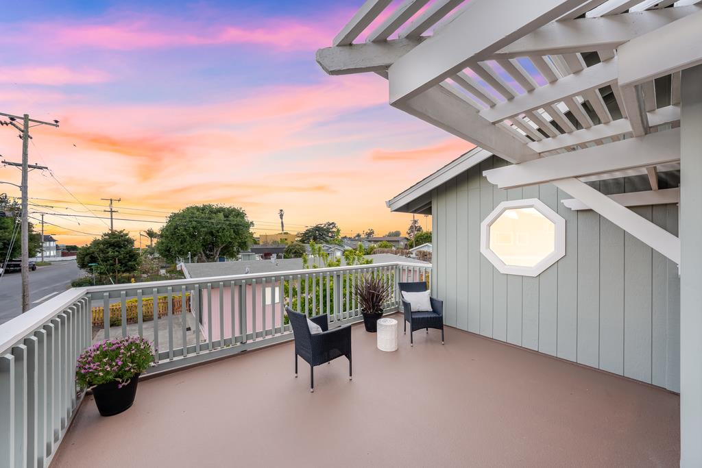 117 El Camino Del Mar Aptos, CA 95003 - Photo 26 of 60 a view of a chair and tables in the balcony
