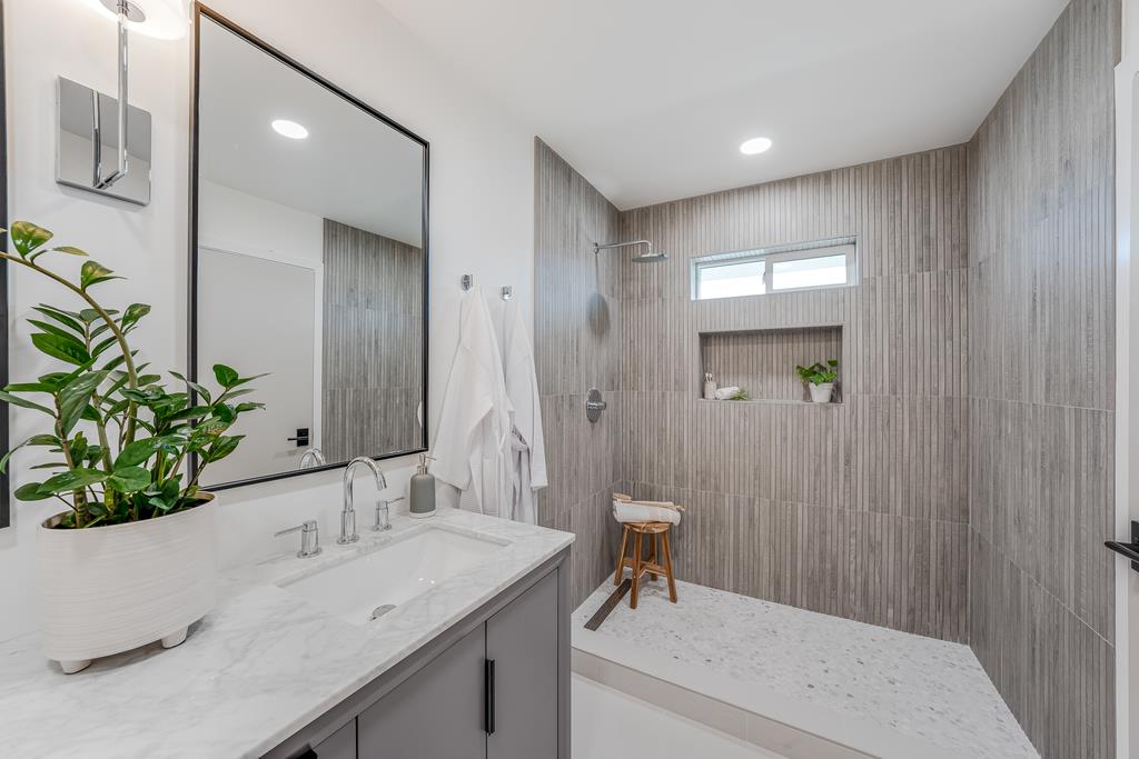 117 El Camino Del Mar Aptos, CA 95003 - Photo 31 of 60 a bathroom with a sink and a mirror