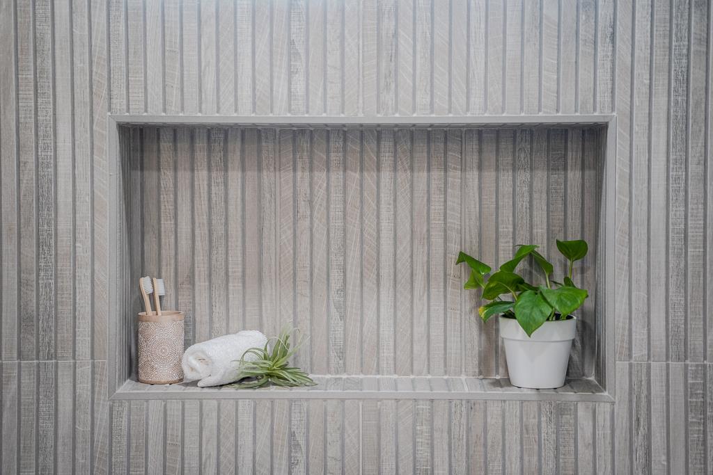 117 El Camino Del Mar Aptos, CA 95003 - Photo 32 of 60 a white vase with white and yellow flowers