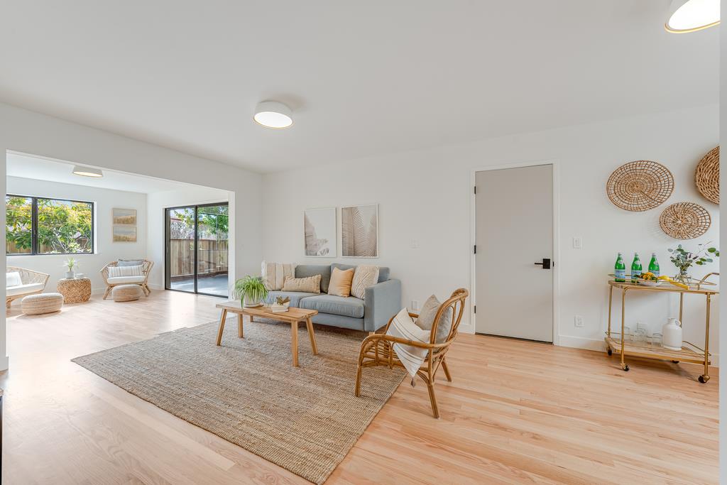 117 El Camino Del Mar Aptos, CA 95003 - Photo 35 of 60 a living room with furniture and a wooden floor