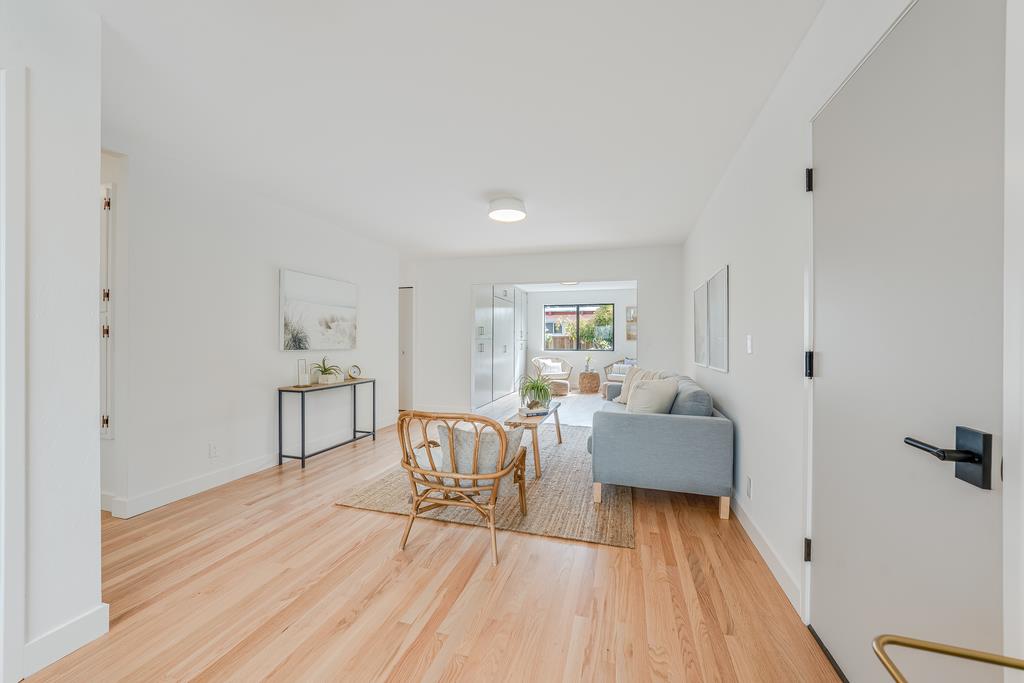 117 El Camino Del Mar Aptos, CA 95003 - Photo 36 of 60 a living room with furniture and a wooden floor