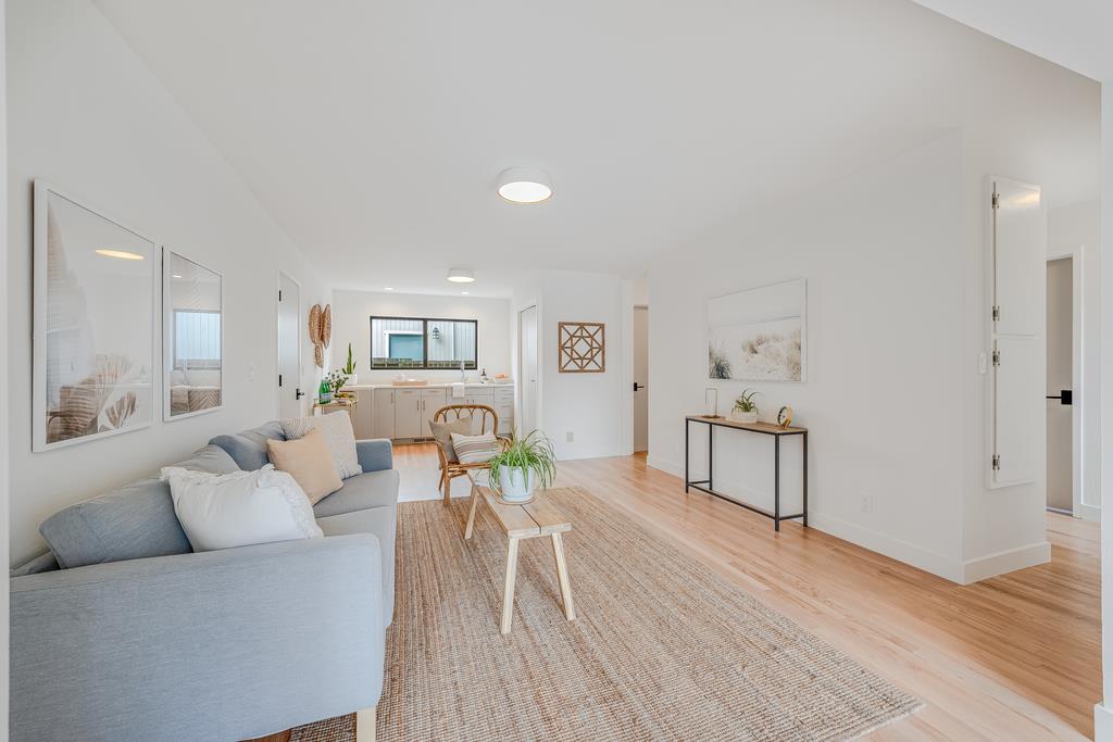 117 El Camino Del Mar Aptos, CA 95003 - Photo 39 of 60 a living room with furniture and a wooden floor
