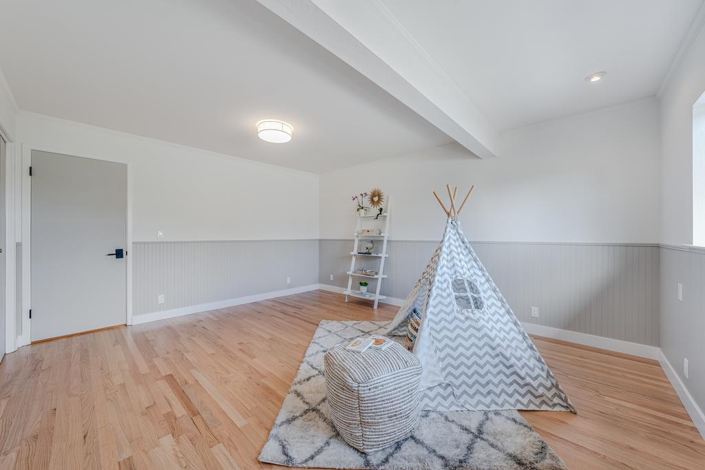 117 El Camino Del Mar Aptos, CA 95003 - Photo 44 of 60 a view of a bedroom with wooden floor and staircase