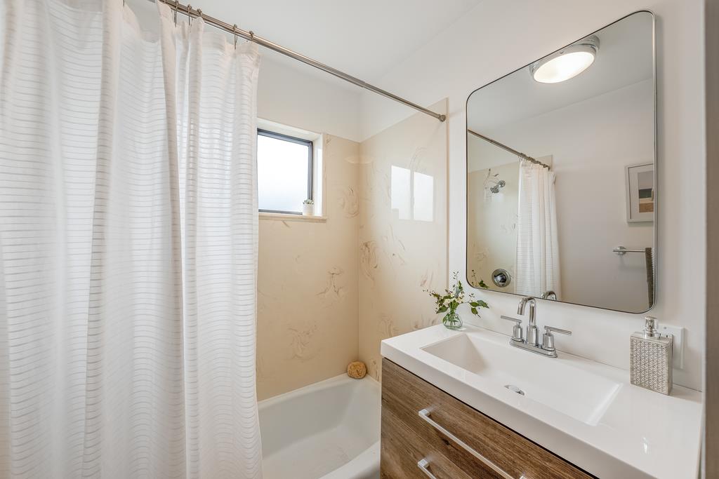 117 El Camino Del Mar Aptos, CA 95003 - Photo 45 of 60 a bathroom with a sink and a mirror
