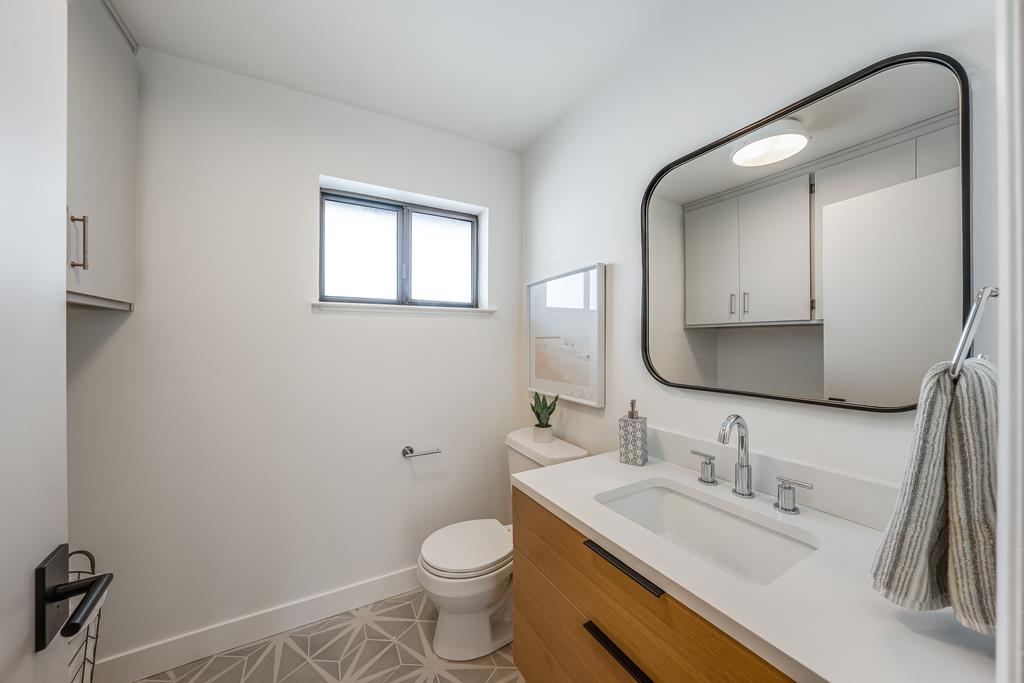 117 El Camino Del Mar Aptos, CA 95003 - Photo 46 of 60 a bathroom with a sink and a mirror