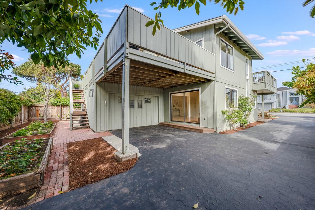 117 El Camino Del Mar Aptos, CA 95003 - Photo 52 of 60 a view of a white house with a small yard and plants