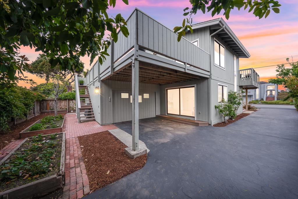 117 El Camino Del Mar Aptos, CA 95003 - Photo 53 of 60 a front view of a house with a yard and garage
