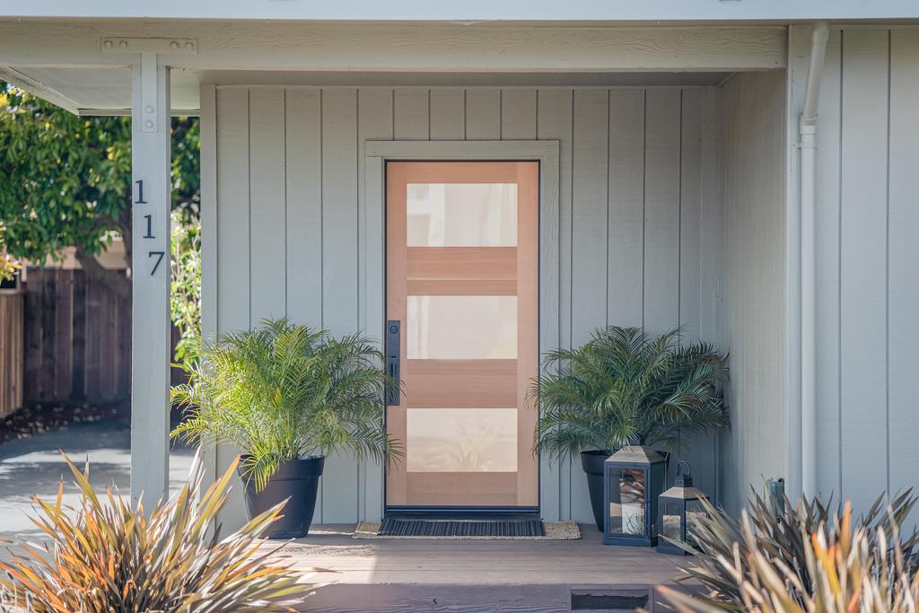 117 El Camino Del Mar Aptos, CA 95003 - Photo 7 of 60 a potted plant sitting in front of a house