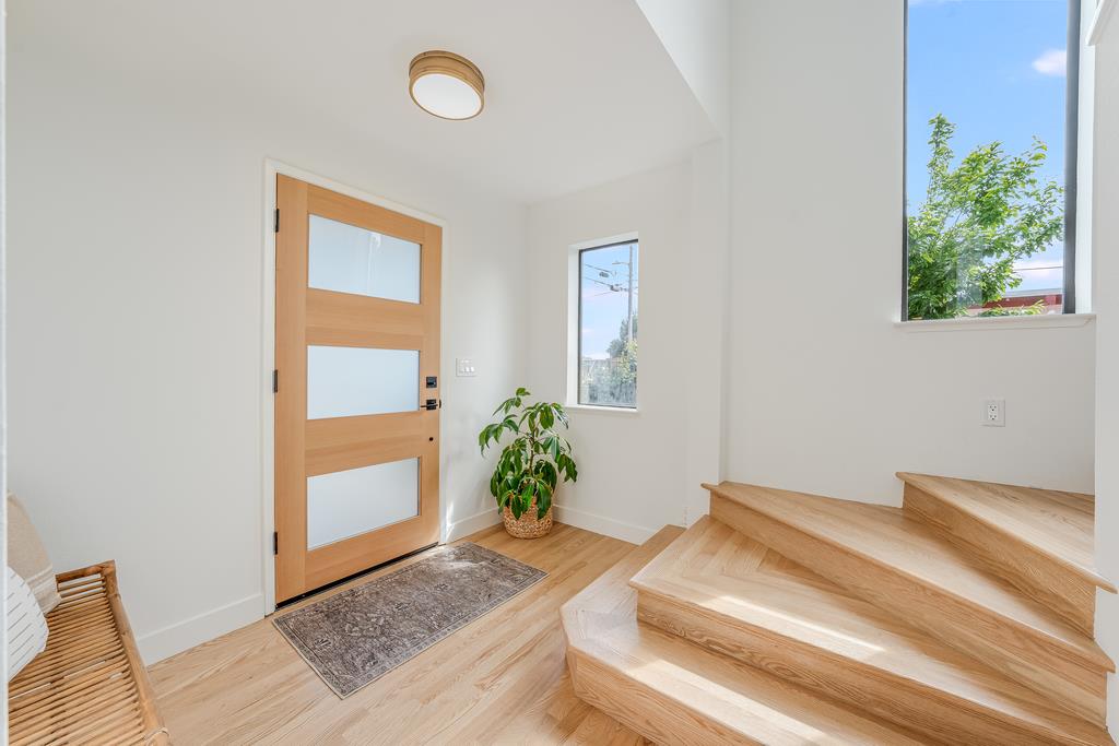117 El Camino Del Mar Aptos, CA 95003 - Photo 9 of 60 a living room with a potted plant and a fireplace